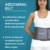 Person wearing an adjustable abdominal belt providing support and compression to the stomach area.